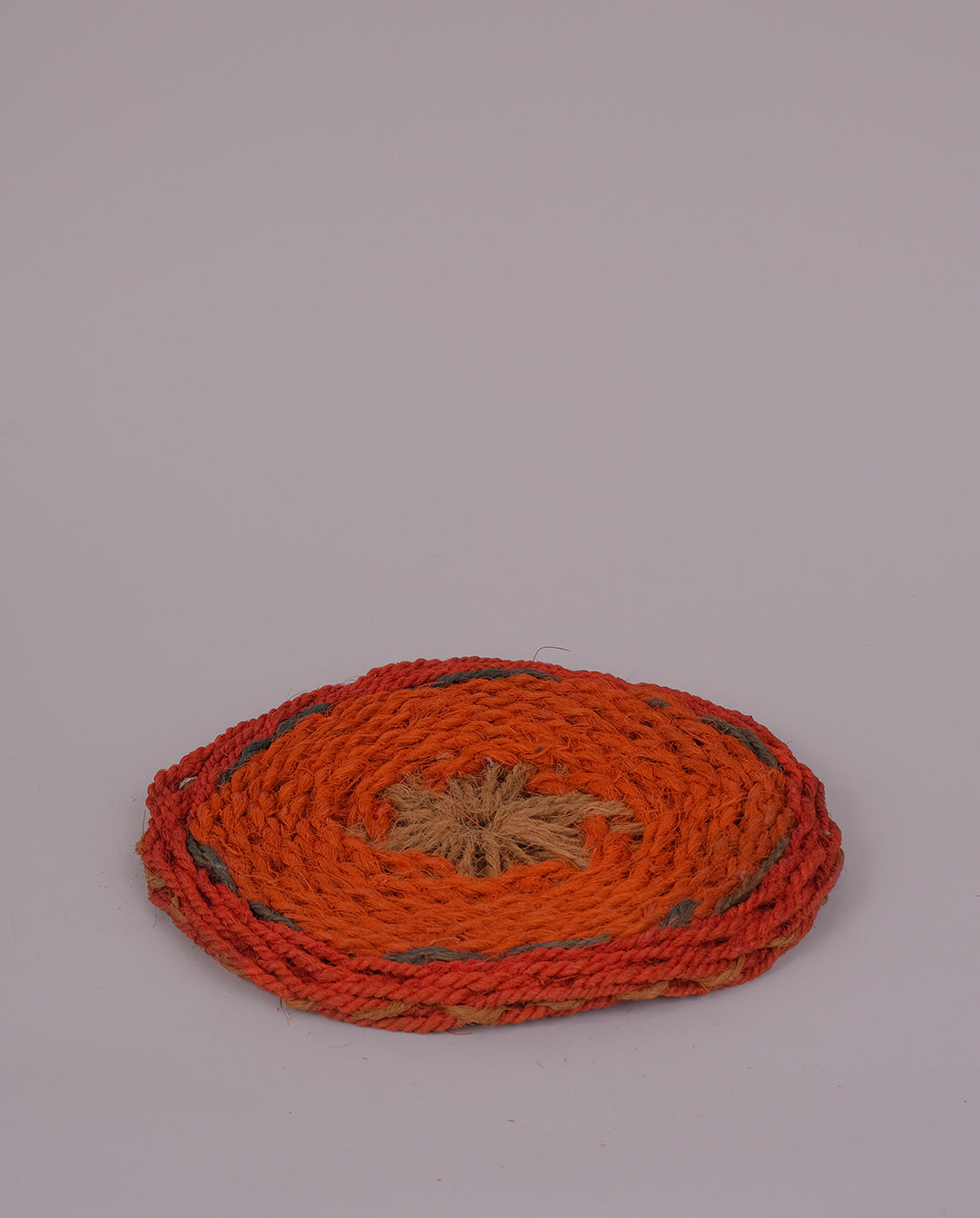 Dessous de plat tressé en fibres naturelles